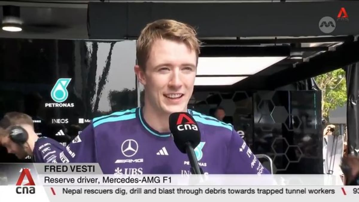Mercedes reserve driver Fred Vesti races down Orchard Road as part of motorsport festival