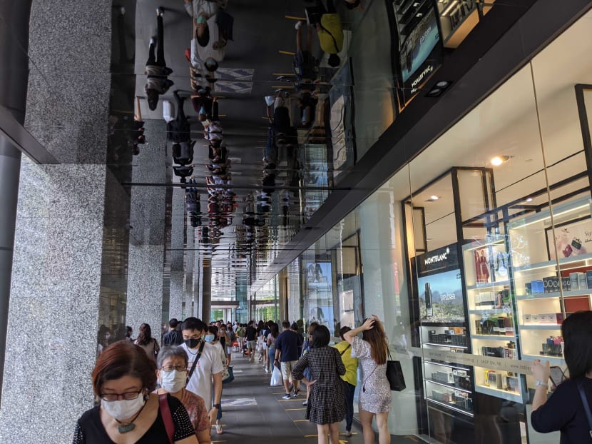 A queue formed outside Robinsons at The Heeren on Oct 30, 2020 after the company announced it would close its remaining stores in Singapore.