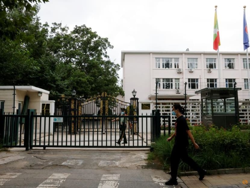 A man walks past a paramilitary police officer keeping watch outside the Myanmar embassy in Beijing, China on Aug 8, 2022. A man walks past a paramilitary police officer keeping watch outside the Myanmar embassy in Beijing, China on Aug 8, 2022.
