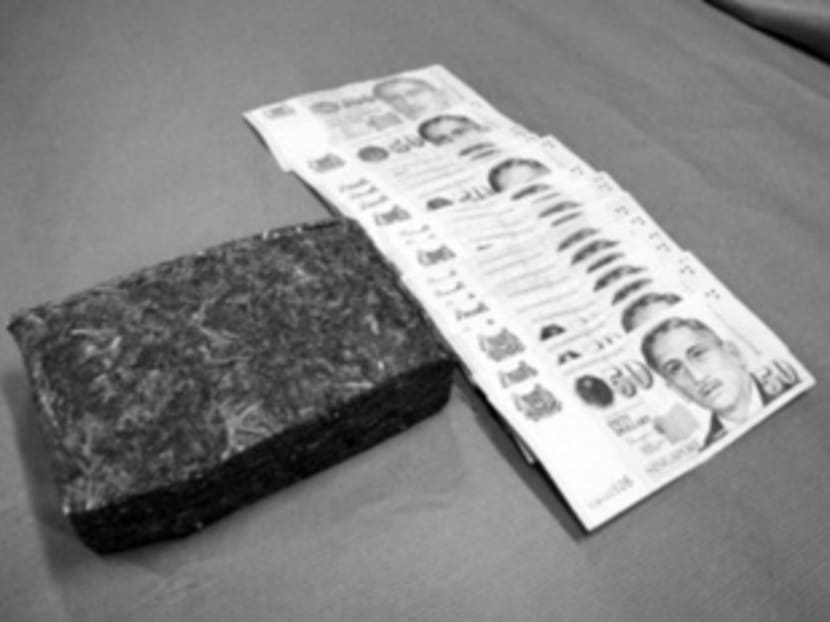 Cannabis and cash seized in an operation. Research supports the view that cannabis should remain an illicit drug. Photo: CNB Cannabis and cash seized in an operation. Research supports the view that cannabis should remain an illicit drug. Photo: CNB