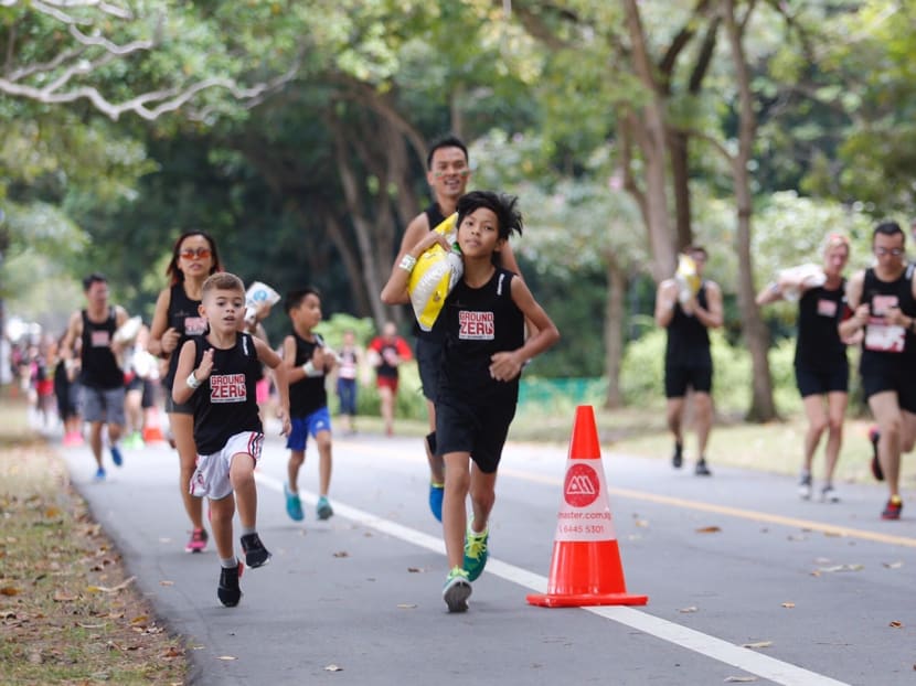 Kids running in the 1km Dash for Humanity which saw kids running with adults at East Coast Park on 13th August. Photo: Najeer Yusof/TODAY