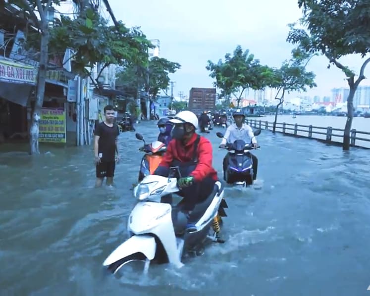 Under siege by climate, man-made problems, a sinking Ho Chi Minh City fights to survive