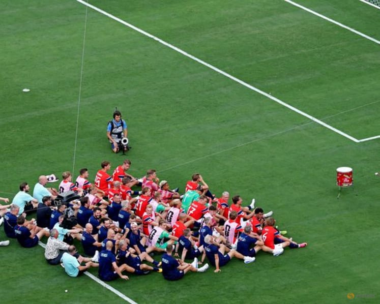 Viking enthusiasts hail spirit, if not technique, of Norway fans' "Viking row"