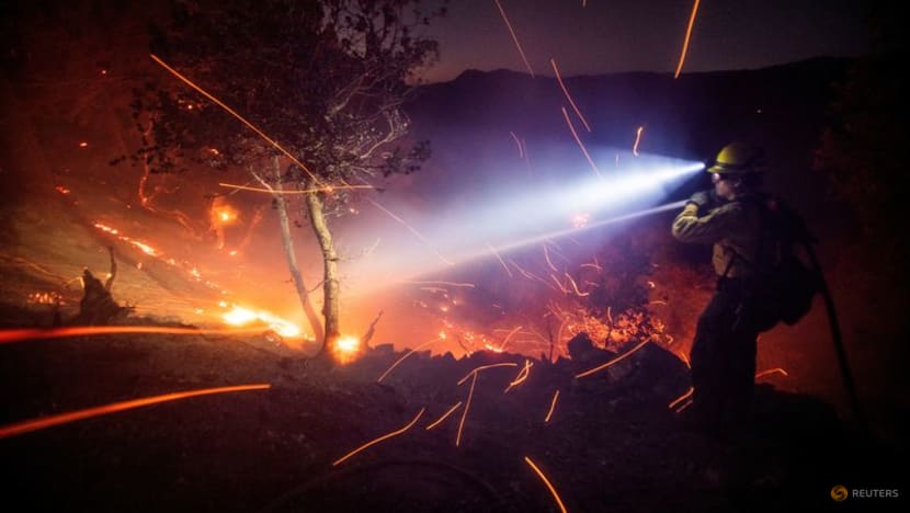 Battle against Los Angeles fires gains ground as intense winds ease Battle against Los Angeles fires gains ground as intense winds ease