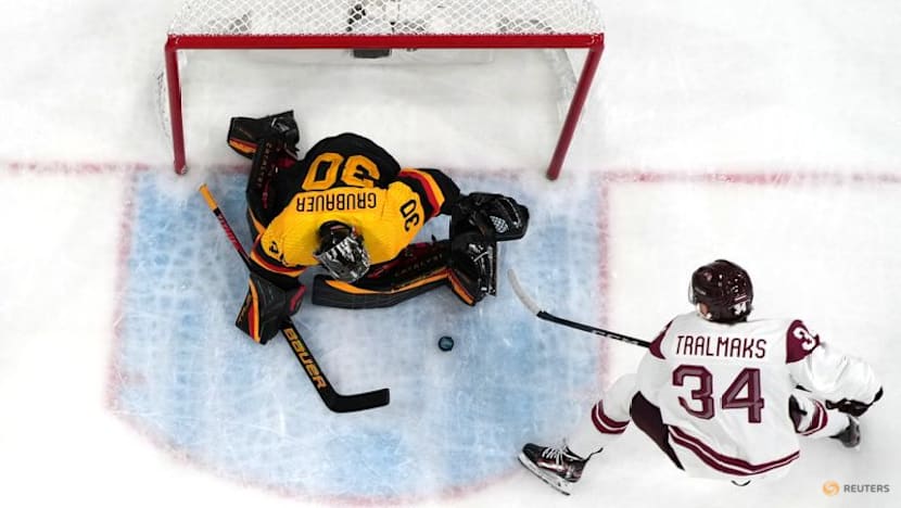 Ice hockey-Slovakia win group, US beat Denmark, Finland, Latvia notch wins