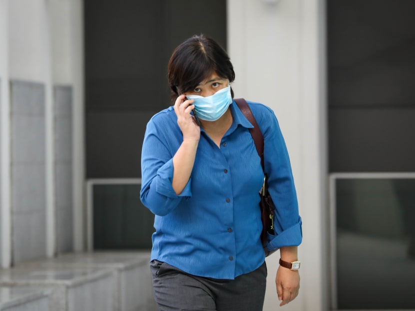 Phoon Chiu Yoke leaving the State Courts on June 8, 2021. She is out on S$8,000 bail.