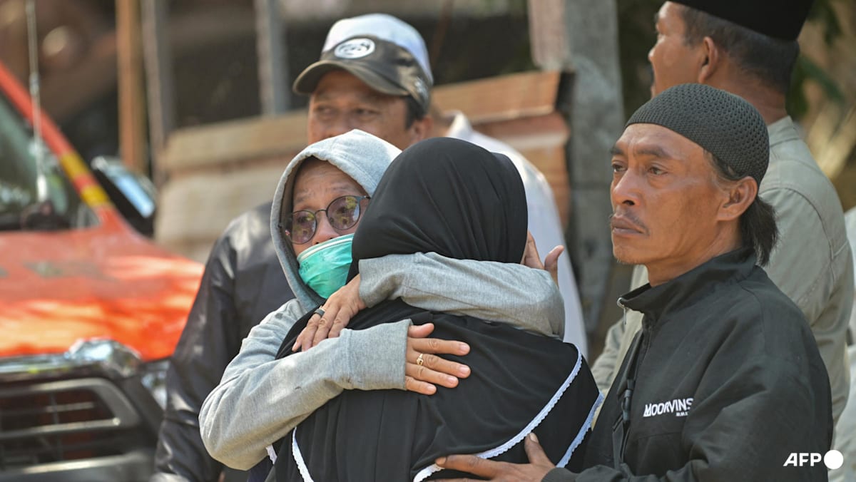 Survivor pulled from Indonesia school collapse as parents await news