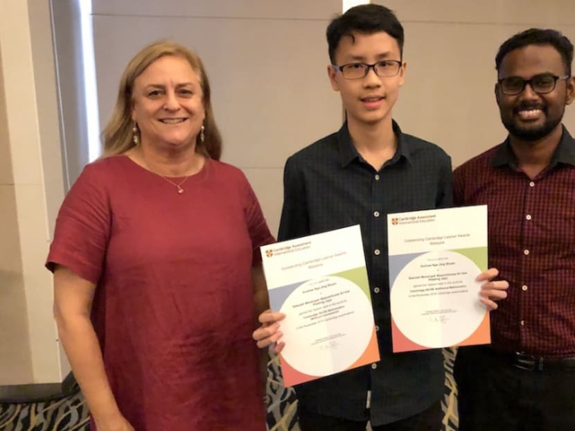 Andrew Nge Jing Shuen (centre) with Beaconhouse Sri Inai International School executive principal Nicki Coombs and add math teacher Devarajen Sinanah.
