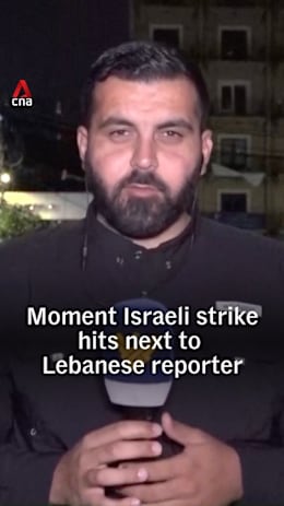 Moment Israeli strike hits next to Lebanese reporter