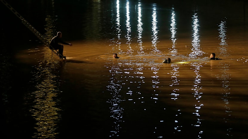 2 women killed after car plunges into Singapore River