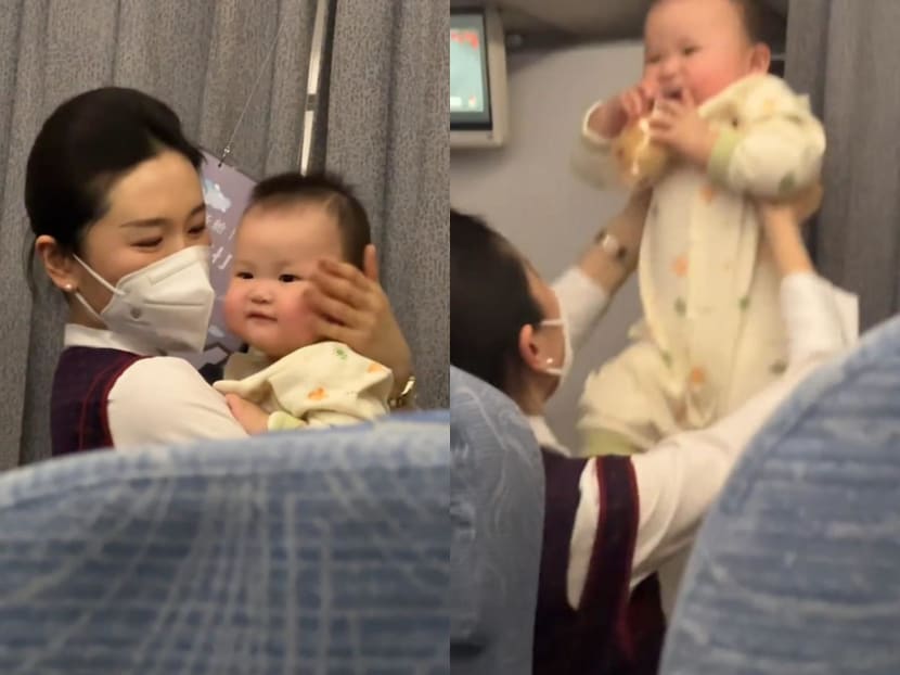 An air stewardess in China (pictured) went the extra mile to help soothe a crying baby.