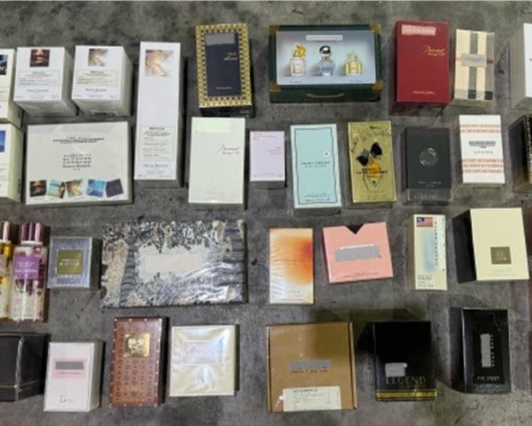 Over S$2 million worth of counterfeit perfume, candles and diffusers seized; man arrested