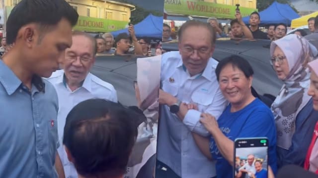 华妇当面“示爱” 安华打趣夫人“别吃醋”
