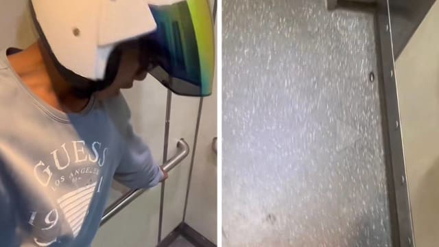 为躲蟑螂跳上电梯手把 送餐员变“蜘蛛人”