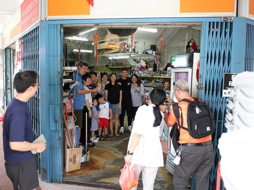 Visitors take photos in Pin Pin Piau Kay & Co on March 31, 2023. The provision store in Tiong Bahru has shuttered its doors after 85 years in business.