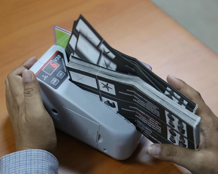 Postal voting for overseas Singaporeans among changes to election laws passed by Parliament