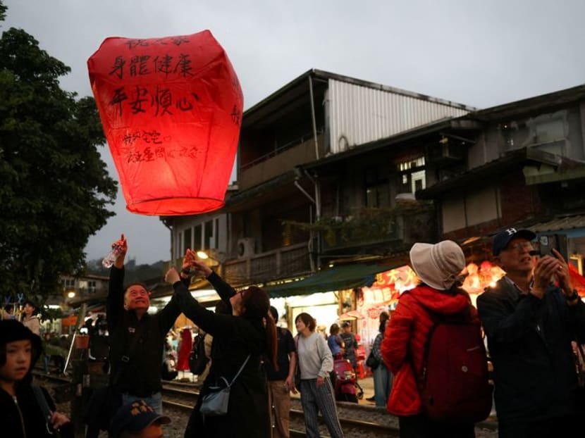 People release a sky lantern ahead of the Lantern Festival in New Taipei city, Taiwan on Feb 17, 2024. People release a sky lantern ahead of the Lantern Festival in New Taipei city, Taiwan on Feb 17, 2024.