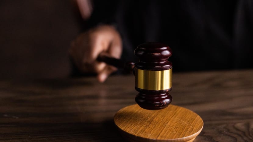 Two to be charged for instructing foreign workers to hold placards in illegal protests