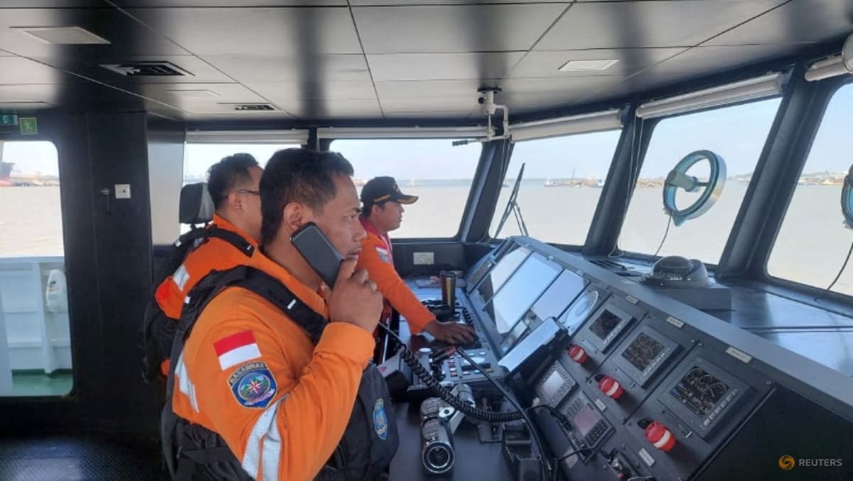 Indonesia rescuers battle turbulent seas in search for 129 people after passenger ship capsizes - CNA