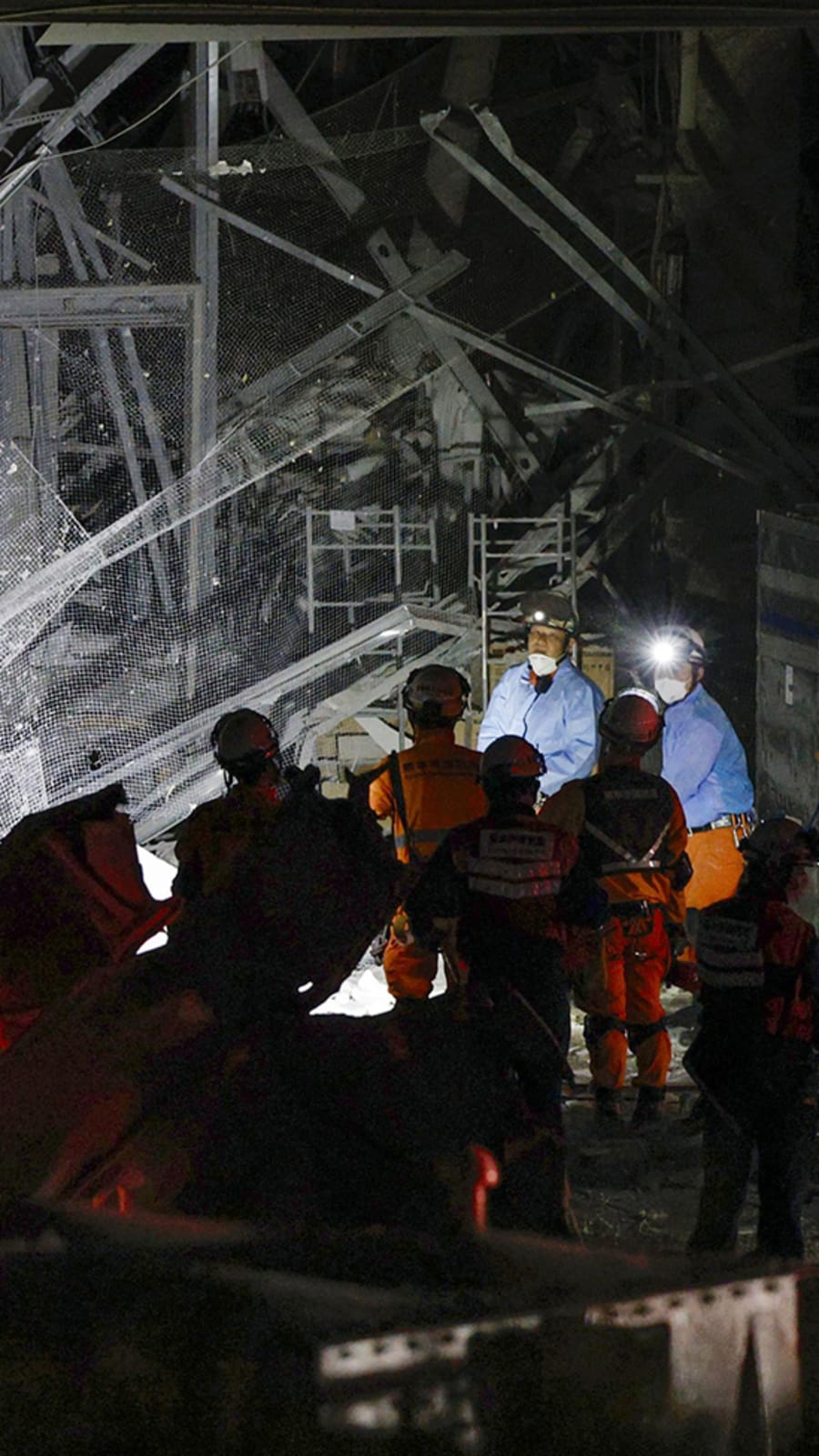 Rescuers in Japan haul survivors from collapsed mall as earthquake toll rises to 13