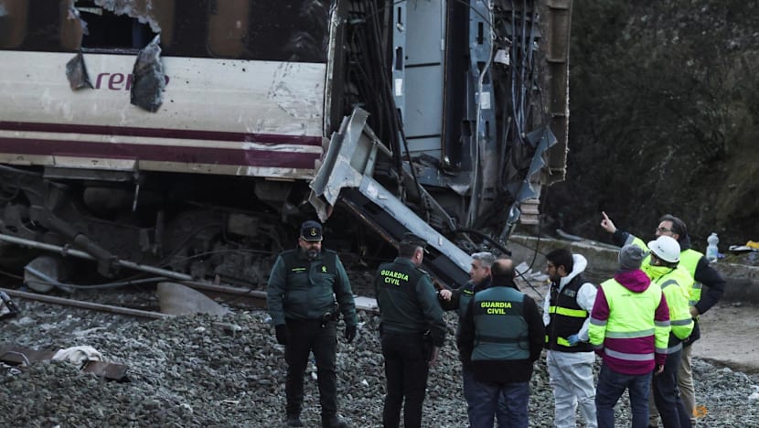 Spain deploys heavy machinery to find missing bodies among train crash wreckage