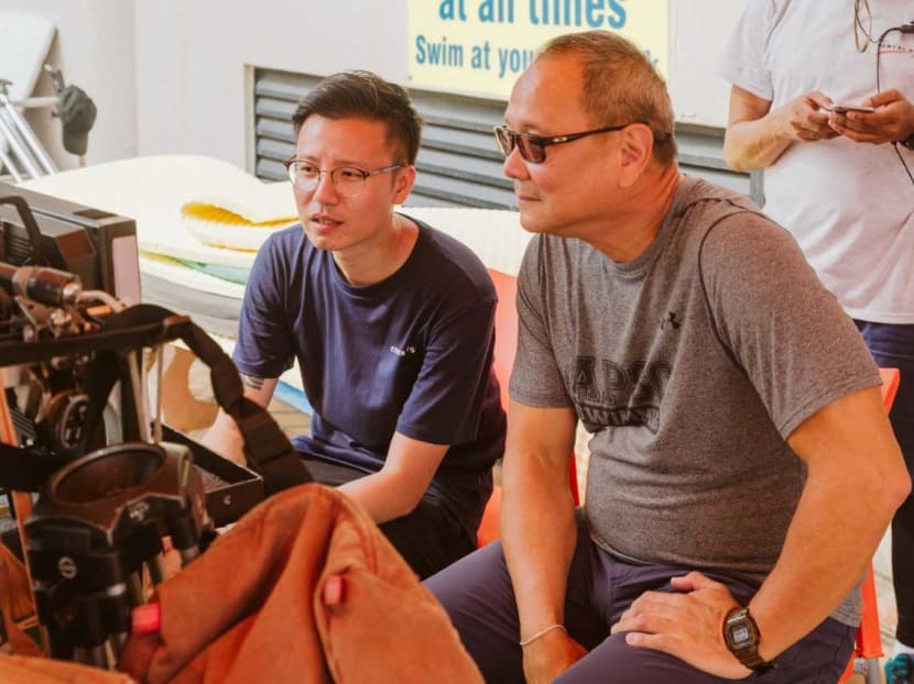 Film-maker Ray Pang and Singapore swimming legend Ang Peng Siong during the production of Mr Pang's film on Farrer Park.