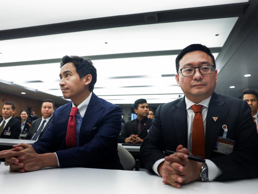 Former Move Forward Party leader Pita Limjaroenrat (left) and party members sit on the day Thailand's Constitutional Court delivers its verdict on the election winner's bid to amend a law against insulting the monarchy, in Bangkok, Thailand on Jan 31, 2024.