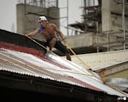  Tropical storm edges toward the Philippines and may grow to a typhoon on path toward China 