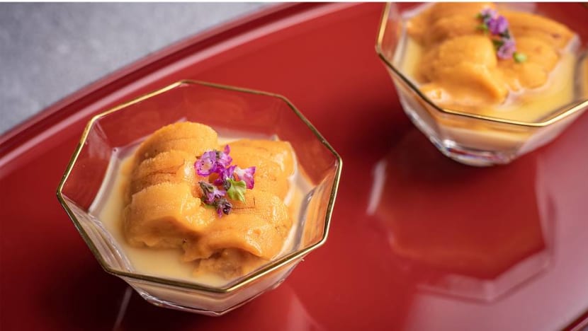 Which new Japanese dining hotspot in Singapore is booked out until August?