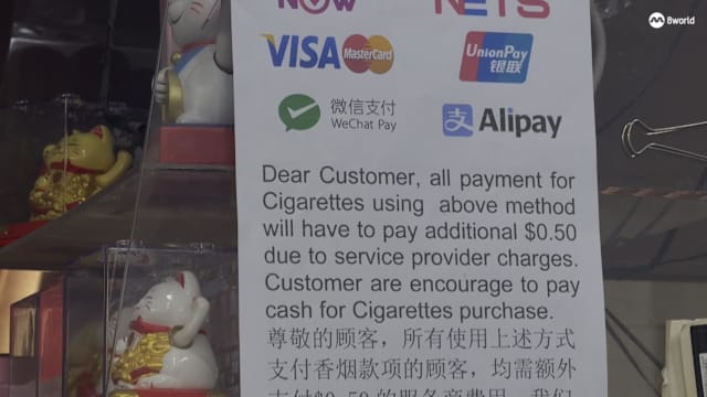 用电子付款买香烟需多付5角钱 杂货店老板：若不收费得倒贴