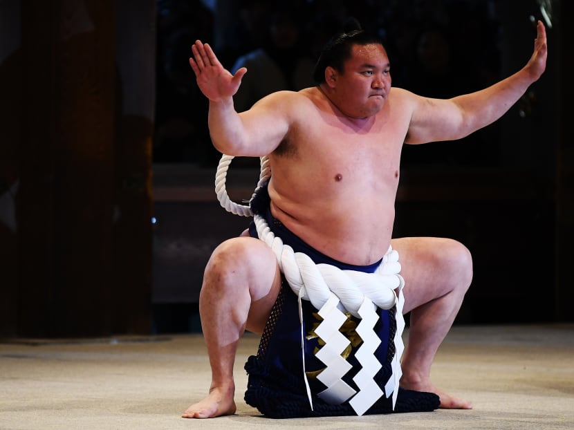 Sumo grand champion or "yokozuna" Hakuho of Mongolia performs a ring-entering ceremony at Meiji shrine in Tokyo on Jan 7, 2020.