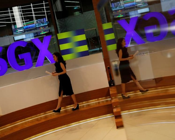 Market watchers less bullish on Singapore stocks this year