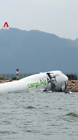 Two dead after cargo plane slides off runway in Hong Kong