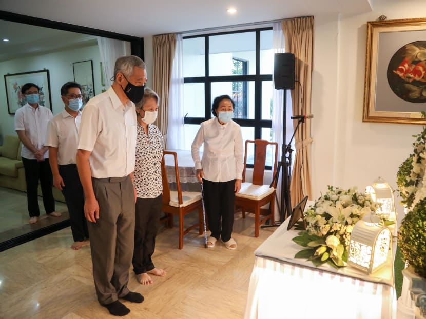 Prime Minister Lee Hsien Loong and his wife Ho Ching paying their respects at the wake of Ngiam Tong Dow on Aug 21, 2020.