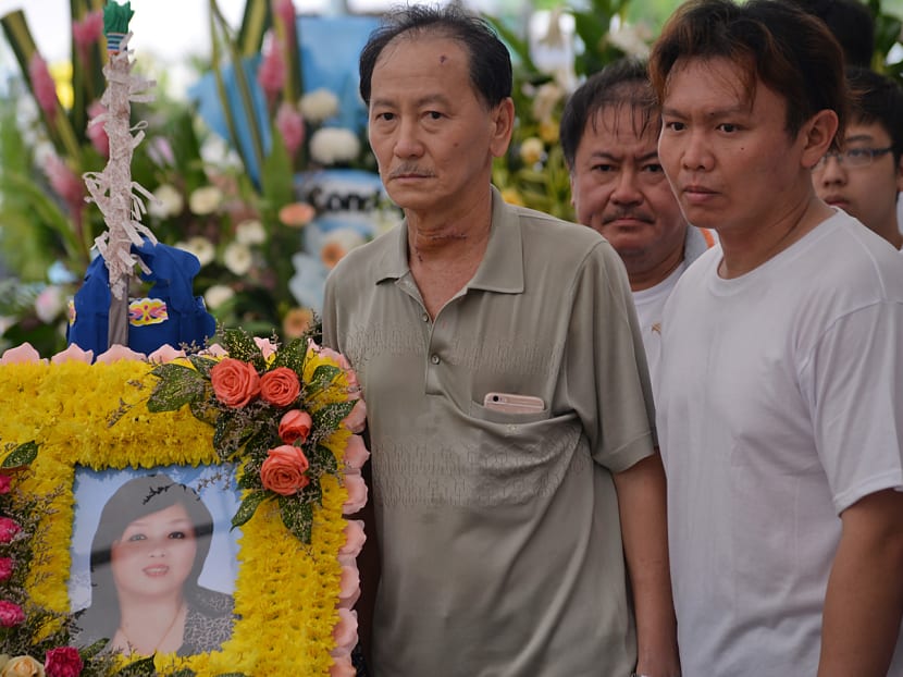 Mr Ong Thiam Soon (in gray), the husband of the victim, Mdm Seow Kim Choo, and one of their two sons, Mr Ong Wei Yang, at the wake. Photo: Robin Choo/TODAY