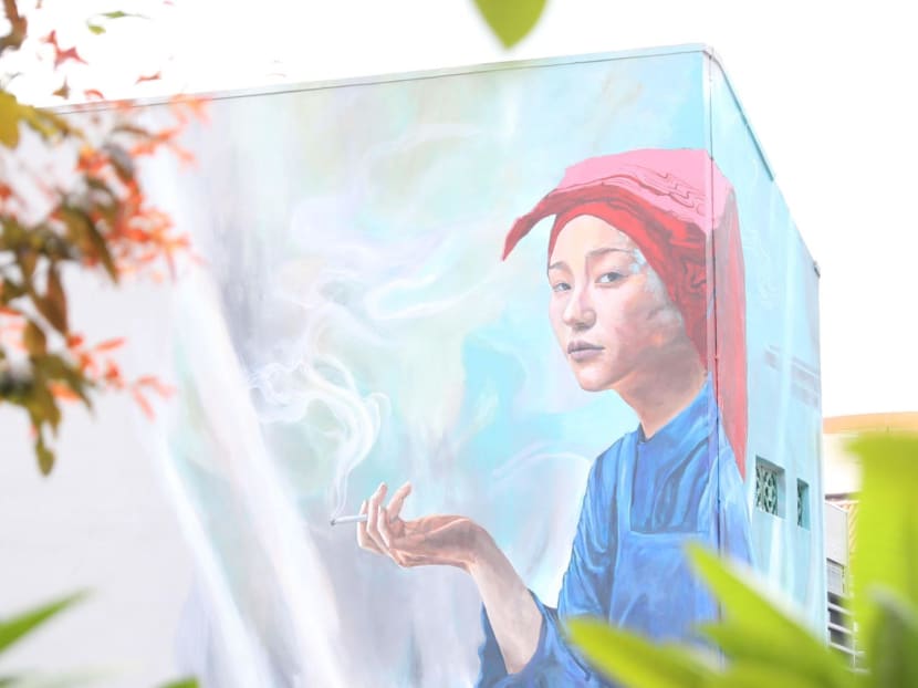 A mural by artist Sean Dunston in Chinatown, featuring the image of a smoking samsui woman. A mural by artist Sean Dunston in Chinatown, featuring the image of a smoking samsui woman.