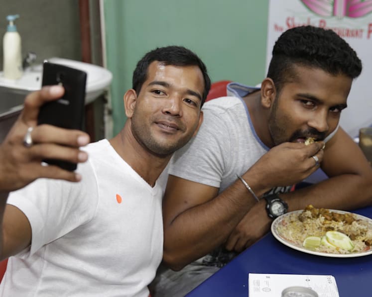 450 needy foreign workers set to get new phones ahead of 3G shift