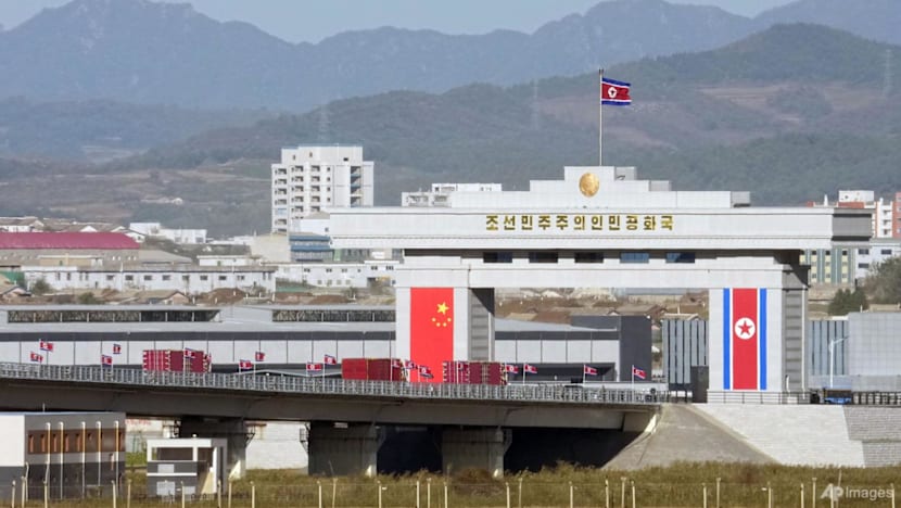 Trucks line up as long-delayed China-North Korea bridge officially opens