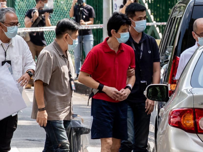 On Jan 27, 2022, Xavier Yap Jung Houn (third from left) was taken to the scene where the bodies of his two sons were found. On Jan 27, 2022, Xavier Yap Jung Houn (third from left) was taken to the scene where the bodies of his two sons were found.