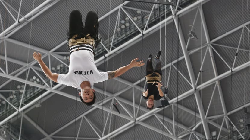 Aerialists soldier on through dizziness, discomfort during NDP practice