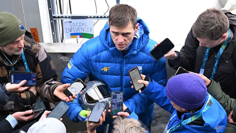 IOC 'begs' defiant Ukrainian to race without war dead helmet