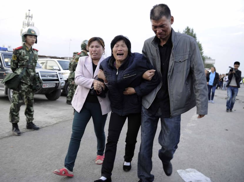 Gallery: China farm fire: Relatives scuffle with police, demand answers