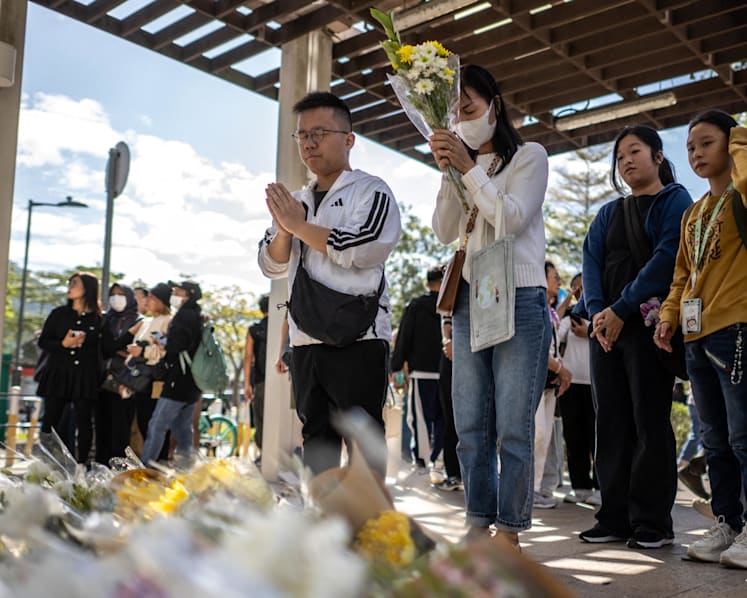 Hong Kong mourns victims of blaze that killed 128 and counting