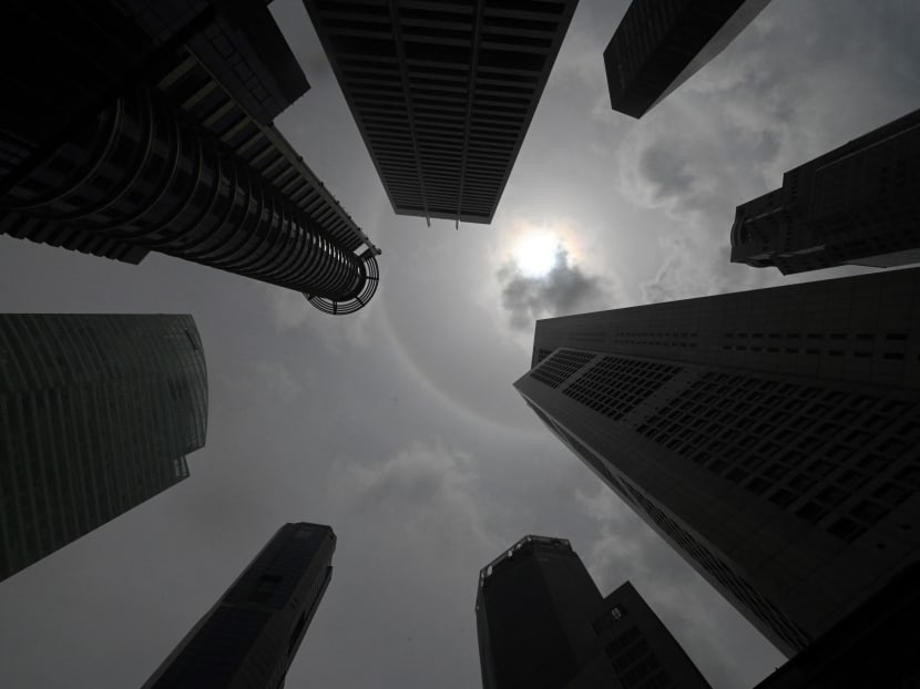 Skyscrapers in Singapore's financial business district silhouetted by the afternoon sun.