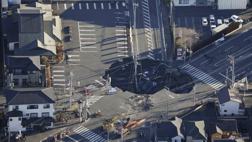 Japan sinkhole grows to almost Olympic pool length with truck driver still trapped Japan sinkhole grows to almost Olympic pool length with truck driver still trapped