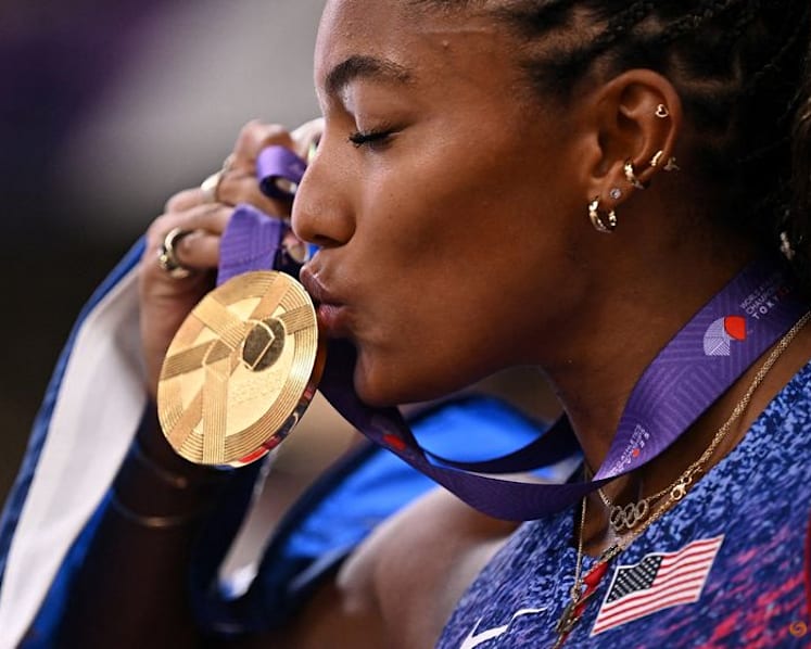 Davis-Woodhall adds world long jump title to Olympic crown