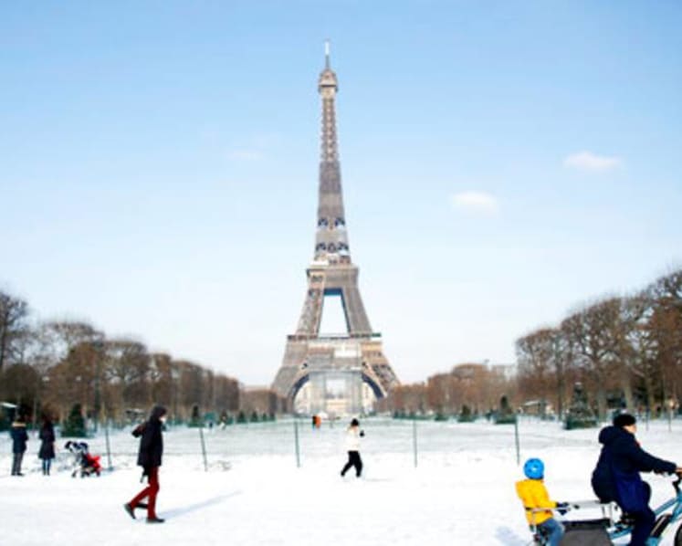 Eiffel Tower needs blowtorch for ice as snow blankets Europe