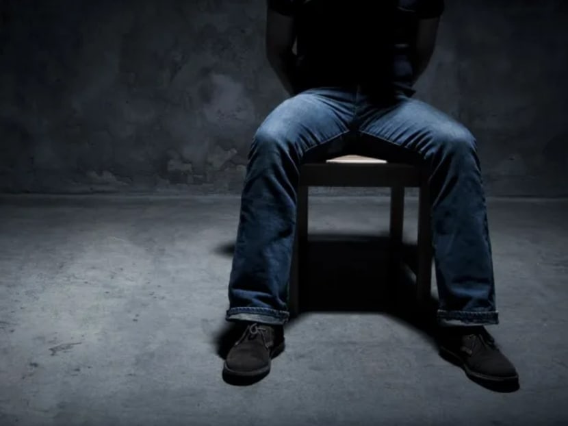 A kidnapped man in a dark room.