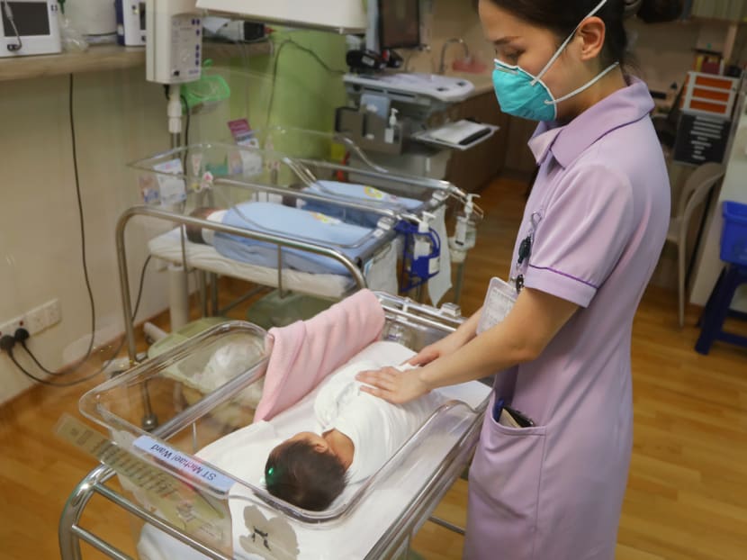 A nurse swaddling a newborn baby at Mount Alvernia Hospital. A nurse swaddling a newborn baby at Mount Alvernia Hospital.
