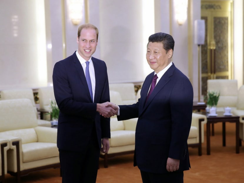 Prince William (left) meeting Chinese President Xi Jinping at the Great Hall of the People in Beijing yesterday. Mr Xi said the British royal family has great influence across the world. Photo: Getty Images
